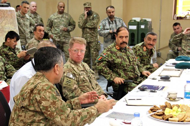 pakistan army lt gen hidayat ur rehman left talks about military operations near the border with afghan security forces and nato leaders on january 18 2014 photo us army