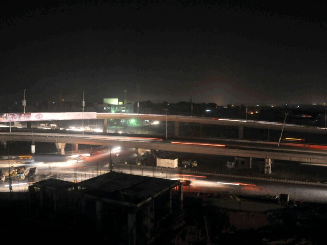 a view of a karachi neighbourhood after saturday night s power breakdown photo express