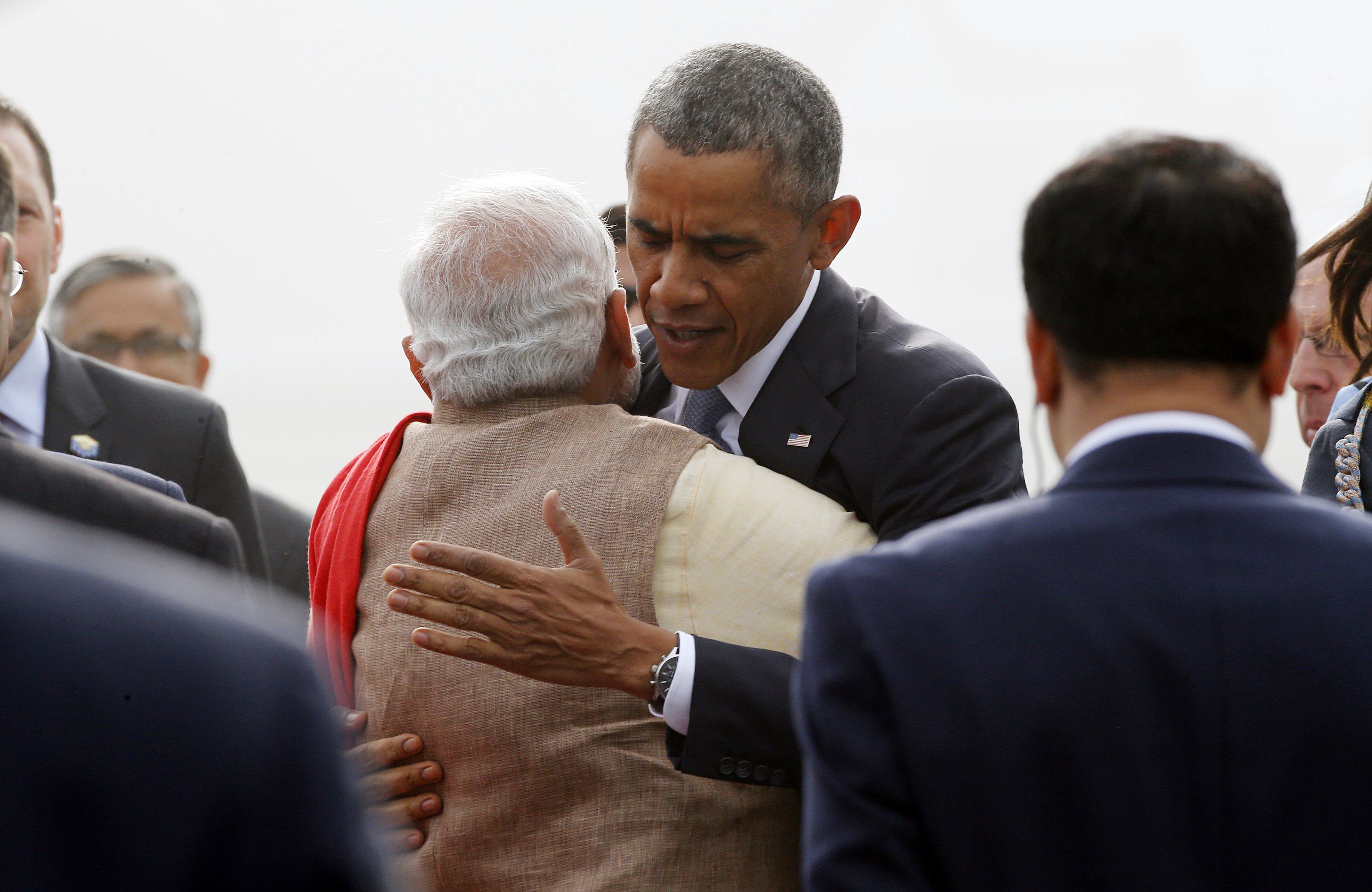 u s president barack obama hugs india 039 s prime minister narenda modi as he arrives at air force station palam in new delhi january 25 2015 photo reuters