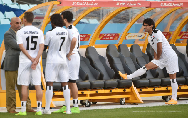 iraqi player alaa abdulzehra r stretches before training for their afc asian cup semi final football match in sydney on january 25 photo afp