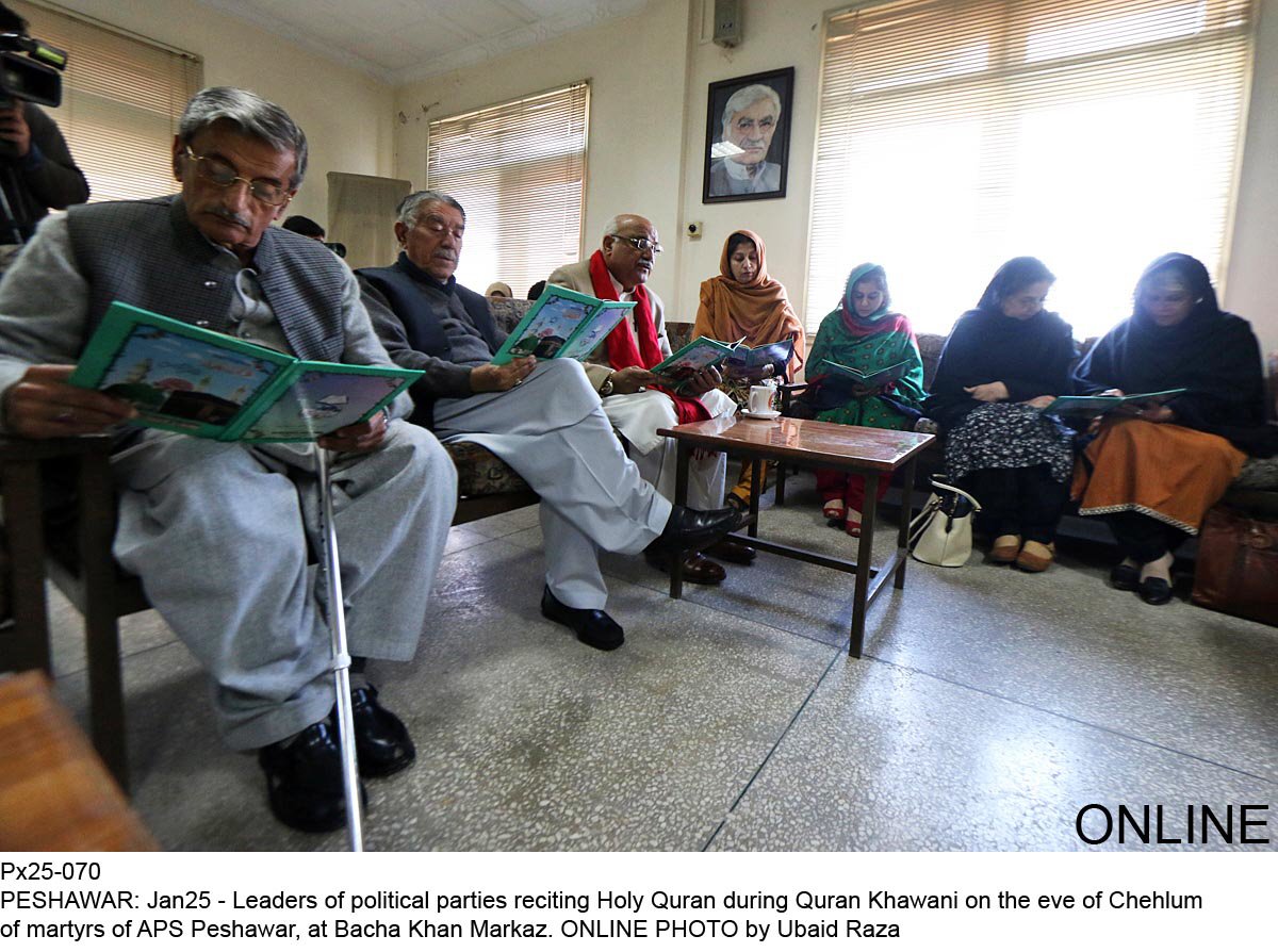 leaders of political parties reciting holy quran during quran khawani on the eve of chehlum of martyrs of aps preshwar at bacha khan markaz photo online