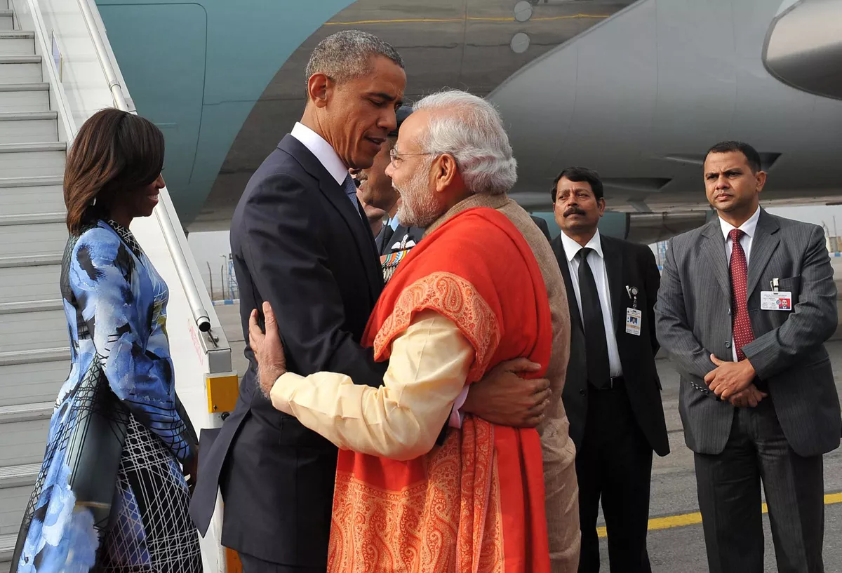 in this handout photograph released by the press information bureau pib on january 25 2015 indian prime minister narendra modi c and us president barack obama hug as the president and us first lady michelle obama l arrive in new delhi photo afp in this handout photograph released by the press information bureau pib on january 25 2015 indian prime minister narendra modi c and us president barack obama hug as the president and us first lady michelle obama l arrive in new delhi photo afp