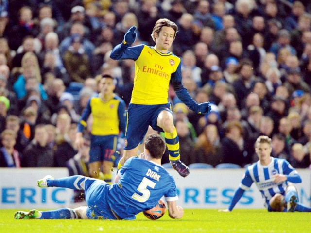 rosicky restored arsenal s two goal lead with a 59th minute volley that was too hot for brighton goalkeeper stockdale to handle photo afp