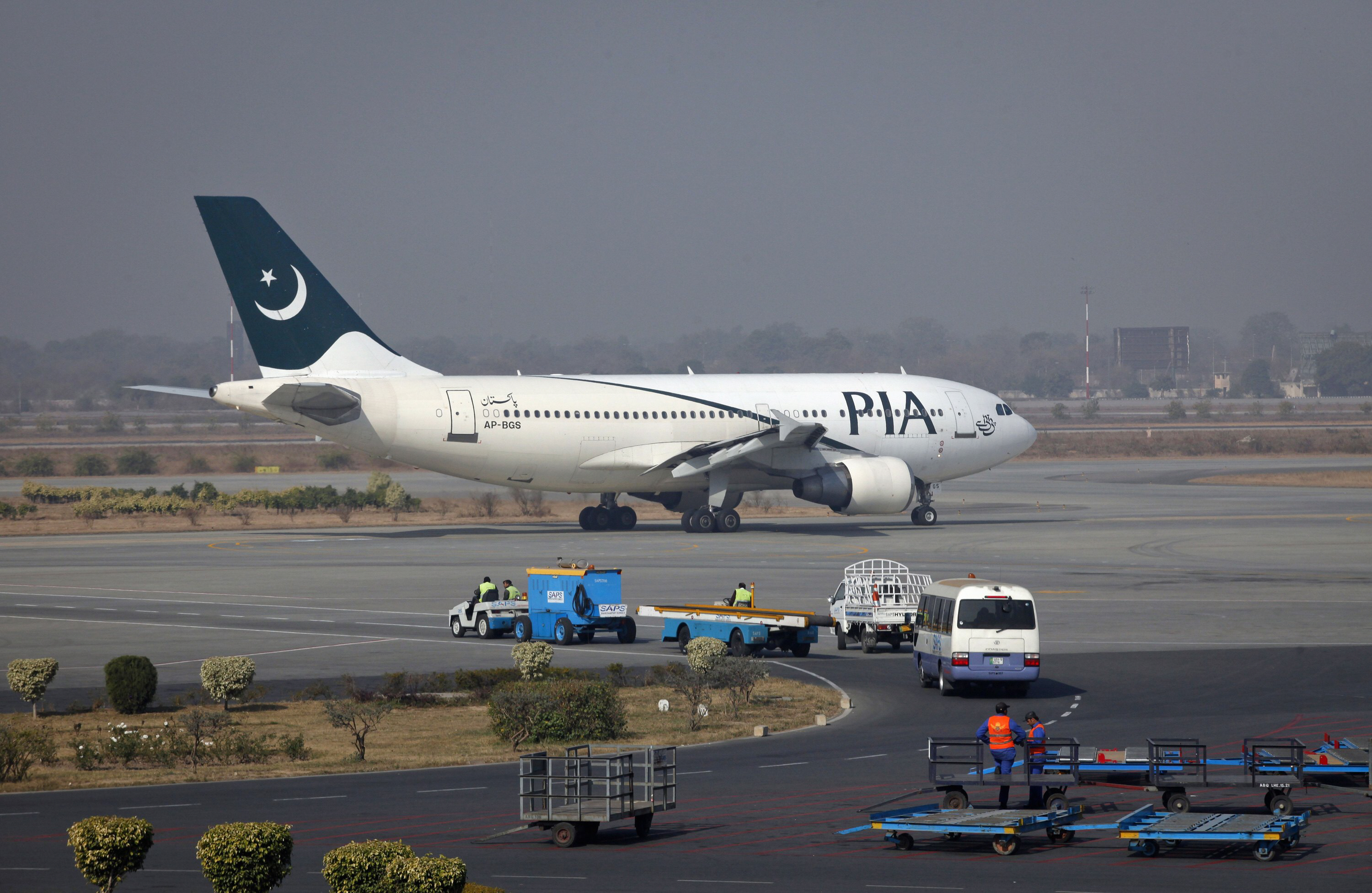 officials checked documents and belongings of hundreds of passengers one by one on flights from karachi and islamabad photo reuters