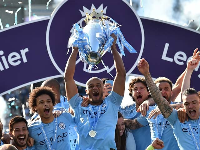manchester city 039 s belgian defender vincent kompany c holds up the premier league trophy after their 4 1 victory in the english premier league photo afp manchester city 039 s belgian defender vincent kompany c holds up the premier league trophy after their 4 1 victory in the english premier league photo afp