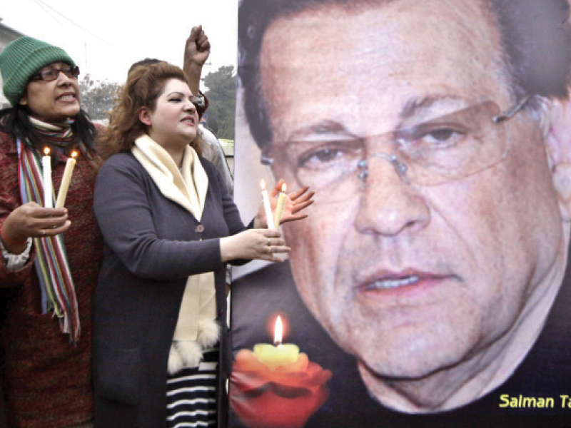 vigil for the slain former governor at liberty roundabout photo shafiq malik express