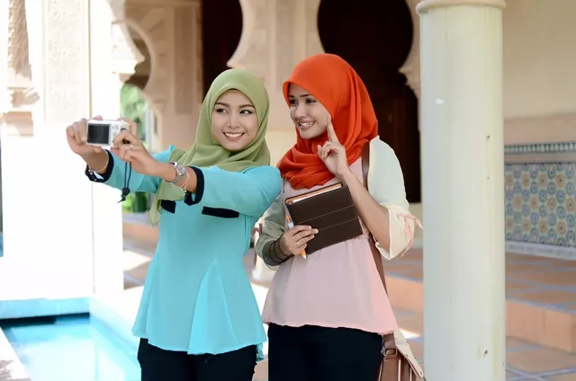 these days many muslim women take selfies without shame says cleric stock image these days many muslim women take selfies without shame says cleric stock image