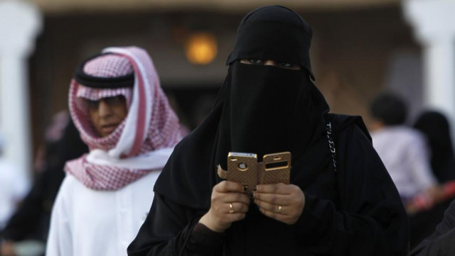 a woman using an iphone visits a festival on the outskirts of riyadh february 13 2012 photo reuters a woman using an iphone visits a festival on the outskirts of riyadh february 13 2012 photo reuters
