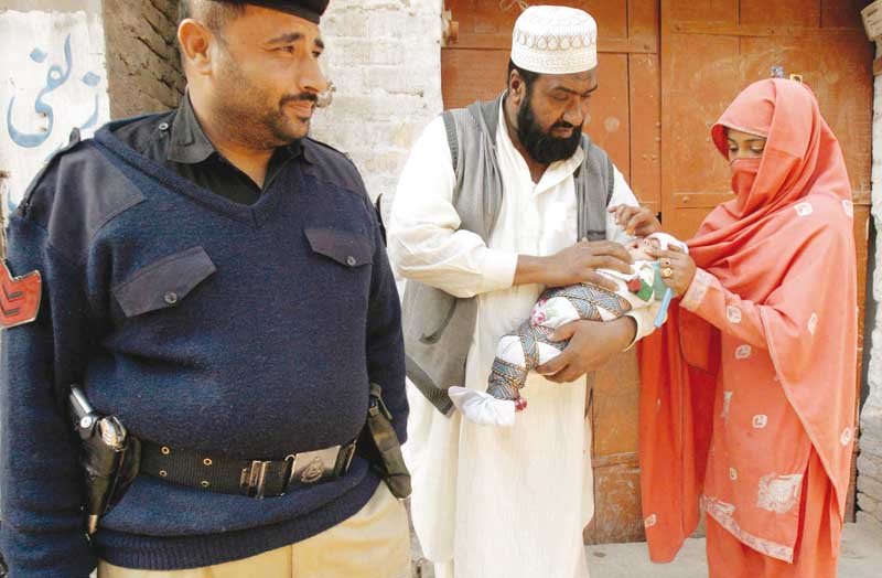 due to the immense threat to their life polio workers are now accompanied by police officials in the field photos by hamid hussain