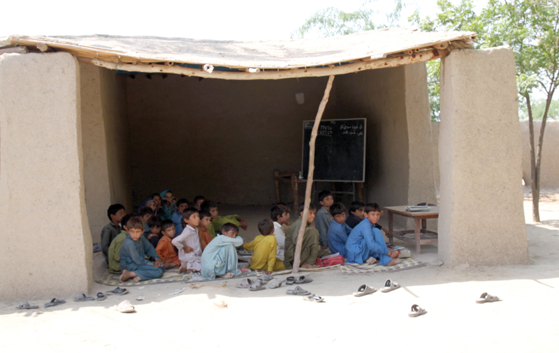 mehboob ali chandio does not allow his visual impairment to come in the way of his teaching he can barely see yet manages to make it from his house to the school to teach his 60 students photo shahzeb ahmed express