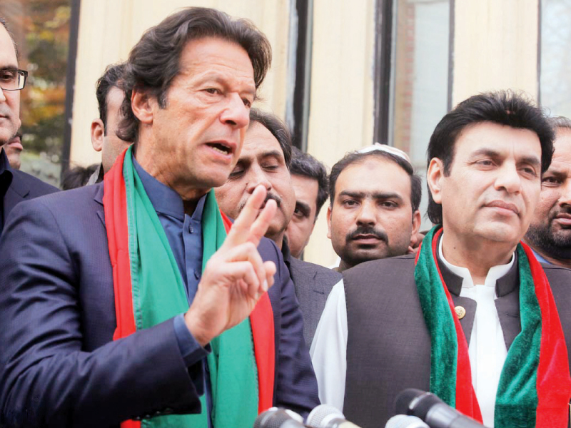 pti chief imran khan talks to the media with mna aijaz ahmed chaudhry at his side photo nni