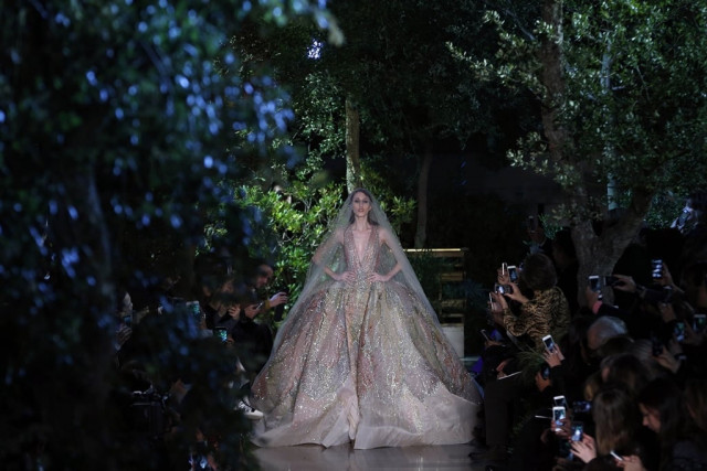 a model presents a creation by elie saab during the 2015 haute couture spring summer collection fashion show on january 28 2015 in paris photo afp a model presents a creation by elie saab during the 2015 haute couture spring summer collection fashion show on january 28 2015 in paris photo afp
