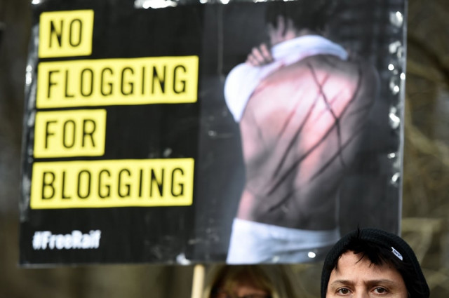 amnesty international activists protest against the flogging punishment of saudi blogger raif badawi on january 29 2015 in front of saudi arabia 039 s embassy to germany in berlin photo afp amnesty international activists protest against the flogging punishment of saudi blogger raif badawi on january 29 2015 in front of saudi arabia 039 s embassy to germany in berlin photo afp