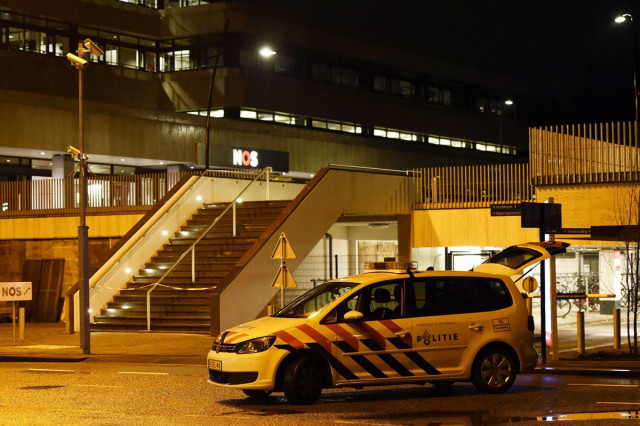 a police car is parked outside the offices of dutch national broadcaster nos in hilversum the netherlands on january 29 2015 photo afp a police car is parked outside the offices of dutch national broadcaster nos in hilversum the netherlands on january 29 2015 photo afp