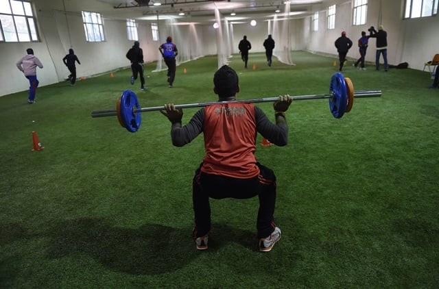 shuttle runs and lifting weights help keep out the bitter chill of the afghan winter as the players tune up for the tournament on warmer antipodean shores photo afp