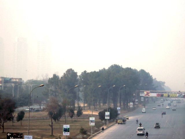 the level of dust in islamabad is so high that the three towers of centaurus beyond the trees are barely visible photo muhammad javaid express the level of dust in islamabad is so high that the three towers of centaurus beyond the trees are barely visible photo muhammad javaid express