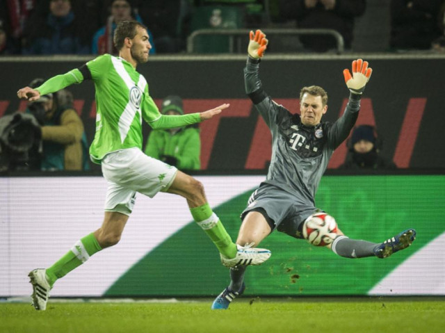 wolfsburg 039 s dutch striker bas dost l shoots the ball during the german first division bundesliga football match vfl wolfsburg v fc bayern muenchen in wolfsburg germany on january 30 2015 photo afp wolfsburg 039 s dutch striker bas dost l shoots the ball during the german first division bundesliga football match vfl wolfsburg v fc bayern muenchen in wolfsburg germany on january 30 2015 photo afp