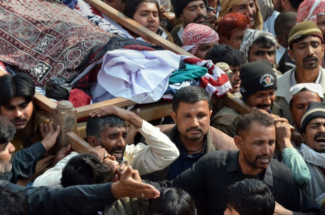 mourners carry the coffin of a blast victim during the funeral ceremony in shikarpur on january 31 2015 photo afp mourners carry the coffin of a blast victim during the funeral ceremony in shikarpur on january 31 2015 photo afp