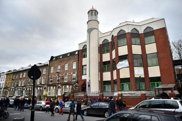 people walk past finsbury park mosque during a mosques open day in london on february 1 2015 photo afp people walk past finsbury park mosque during a mosques open day in london on february 1 2015 photo afp