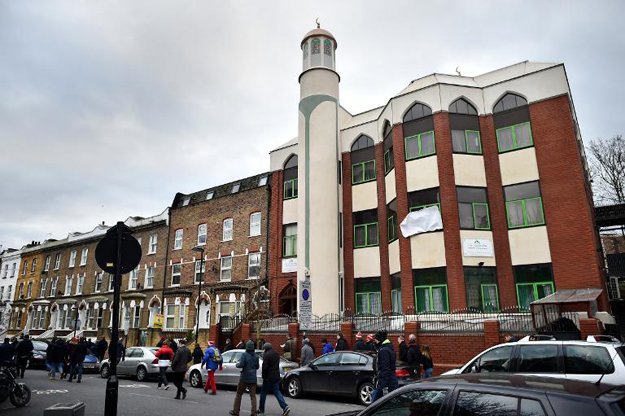 people walk past finsbury park mosque during a mosques open day in london on february 1 2015 photo afp