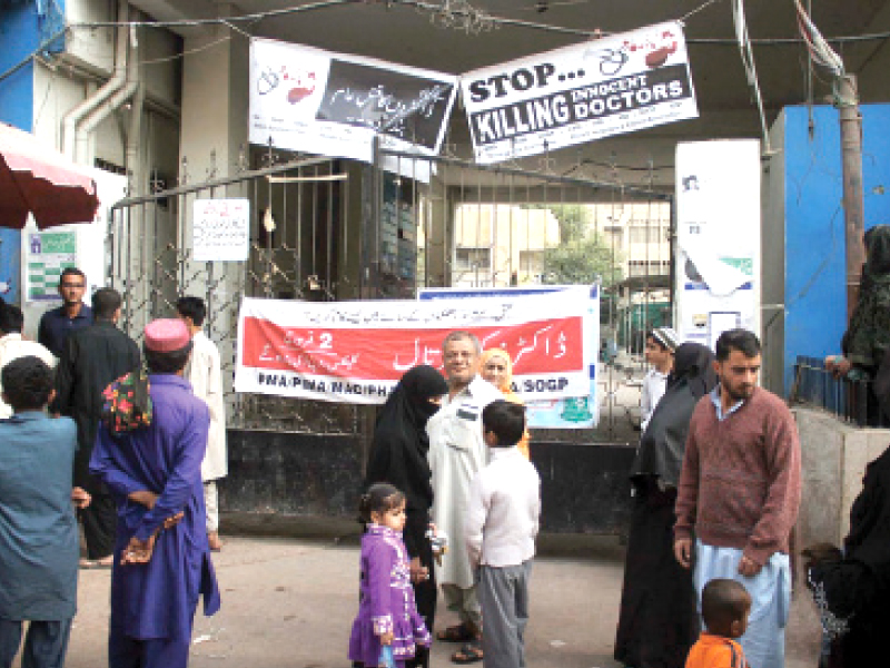 patients and their relatives stand outside civil hospital karachi the city s doctors closed their doors to patients visiting public and private hospitals on monday to protest the wave of attacks on medical practitioners photo online
