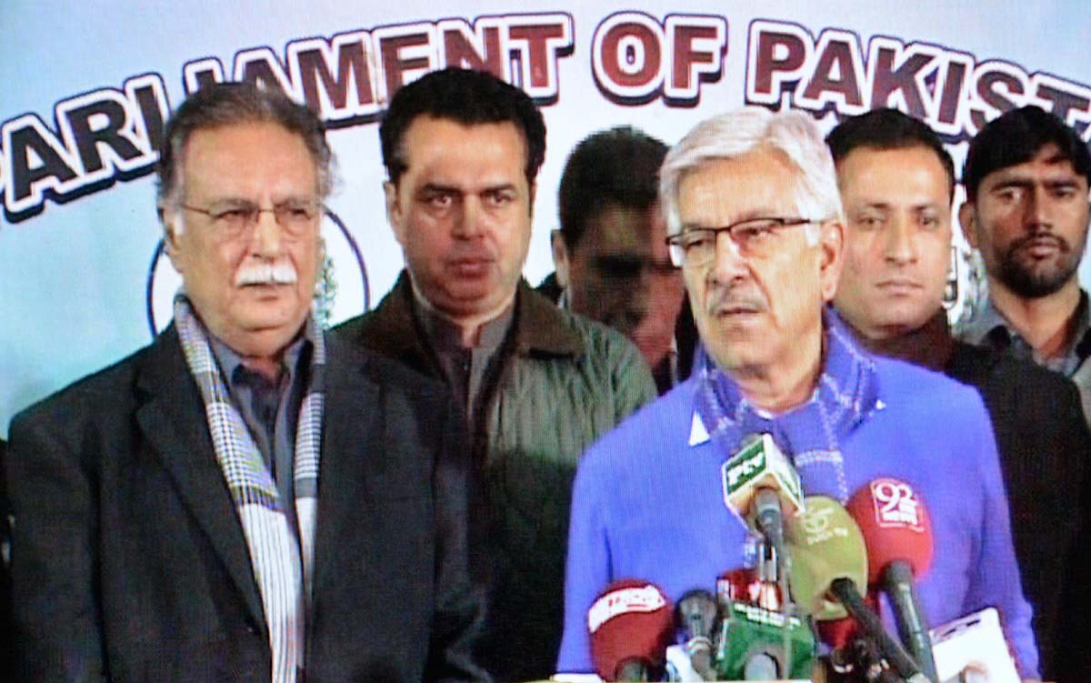 federal minister for information broadcasting amp nh senator pervaiz rashid and federal minister for water and power amp defemce khwaja muhammad asif talking to the media outside parliament house on february 2 photo app