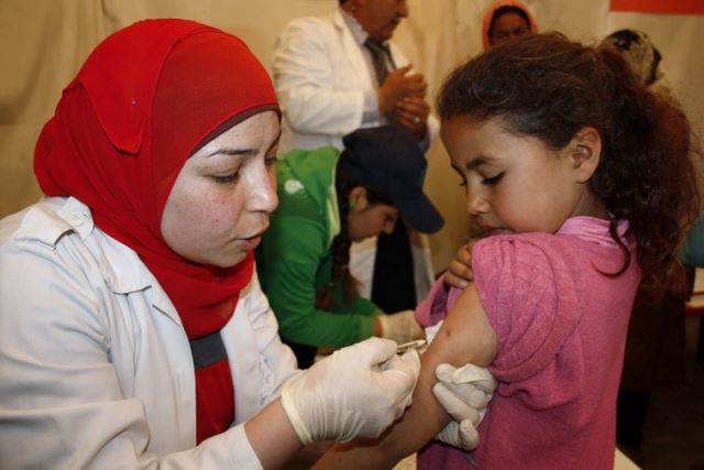 a syrian refugee child in lebanon receives a polio vaccine photo afp