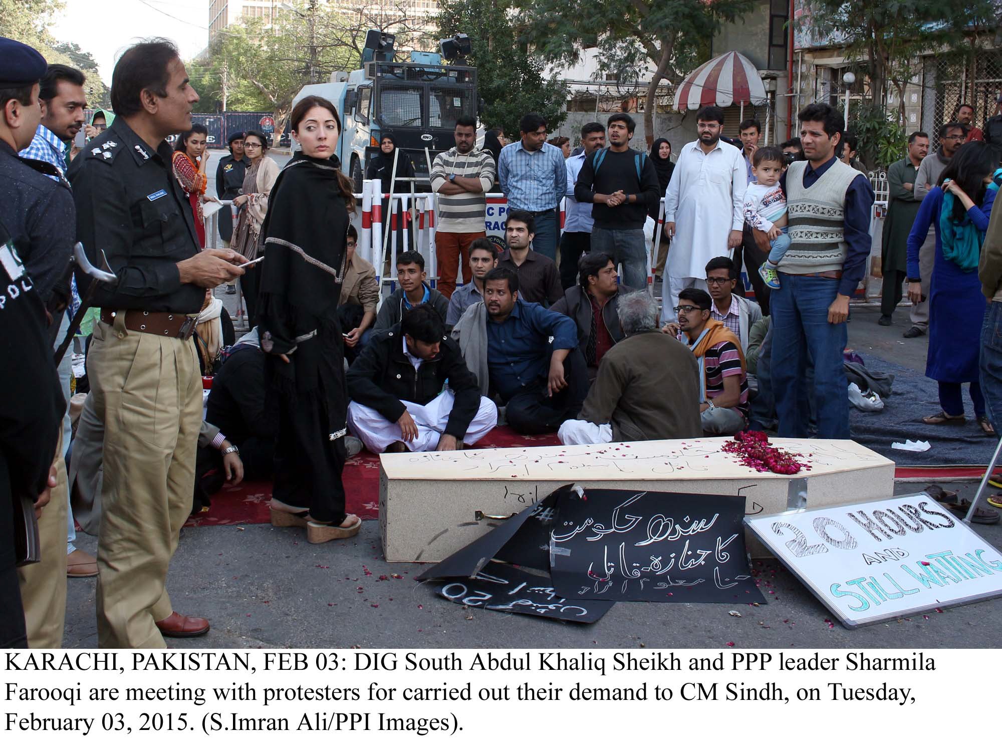 dig khalique shaikh and ppp leader sharmila farooqi negotiating with protesters outside cm house in karachi photo ppi