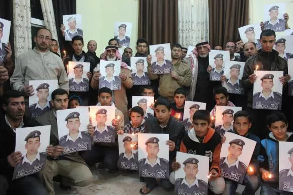 relatives of islamic state captive jordanian pilot muath al kasaesbeh hold his portrait as they take part in a rally in his support at the family 039 s headquarters in the city of karak photo reuters relatives of islamic state captive jordanian pilot muath al kasaesbeh hold his portrait as they take part in a rally in his support at the family 039 s headquarters in the city of karak photo reuters