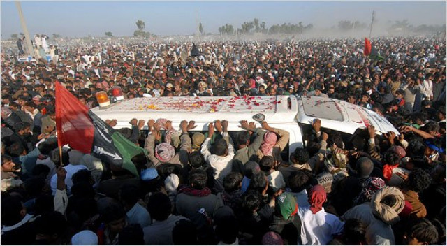 the ambulance carrying benazir bhutto s coffin crawled through mourners photo afp the ambulance carrying benazir bhutto s coffin crawled through mourners photo afp