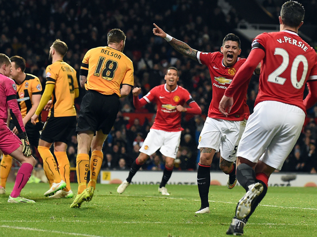 on target juan mata marcos rojo and james wilson fired the ball in the back of the net to award manchester united a comfortable win over cambridge united in the fa cup fourth round photo afp