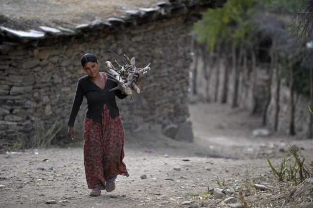 nepalese resident dana sunar c 18 who is the last member of the dalit caste in her class carries firewood in simikot the headquarters of humla district some 430 kms north west of kathmandu photo afp nepalese resident dana sunar c 18 who is the last member of the dalit caste in her class carries firewood in simikot the headquarters of humla district some 430 kms north west of kathmandu photo afp