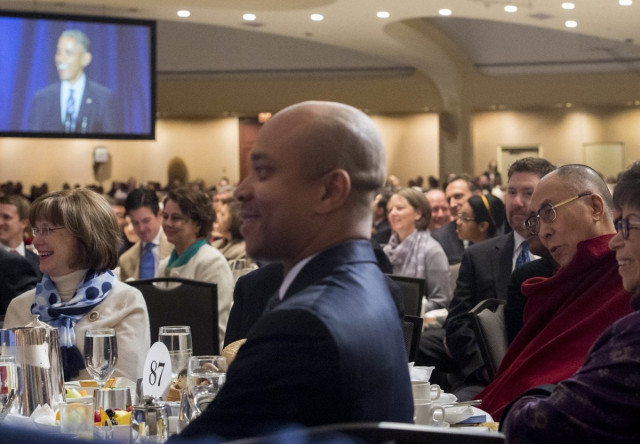 the dalai lama r listens as us president barack obama appears on a televison screen as he speaks during the national prayer breakfast in washington dc february 5 2015 photo afp the dalai lama r listens as us president barack obama appears on a televison screen as he speaks during the national prayer breakfast in washington dc february 5 2015 photo afp