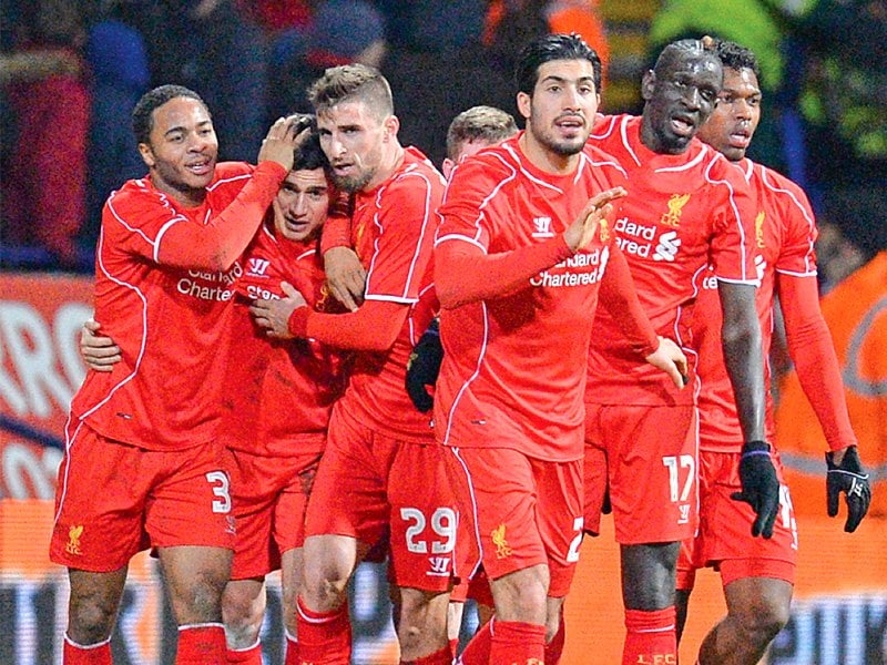 liverpool scored two late goals to go through against bolton in their fourth round fa cup replay