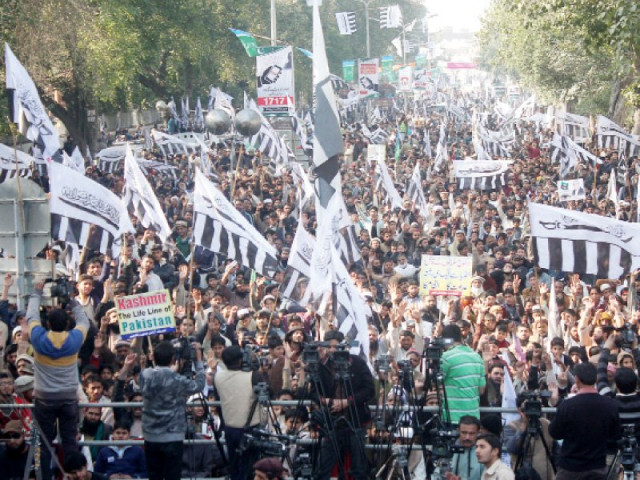 thousands of jud members held flags and banners demanding solution to the kashmir issue photo abid nawaz express
