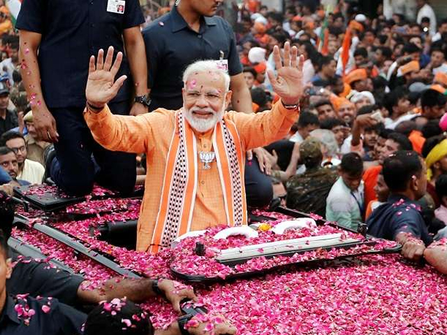 pm narendra modi at a mega roadshow in varanasi joined by thousands of supporters party workers and locals photo reuters