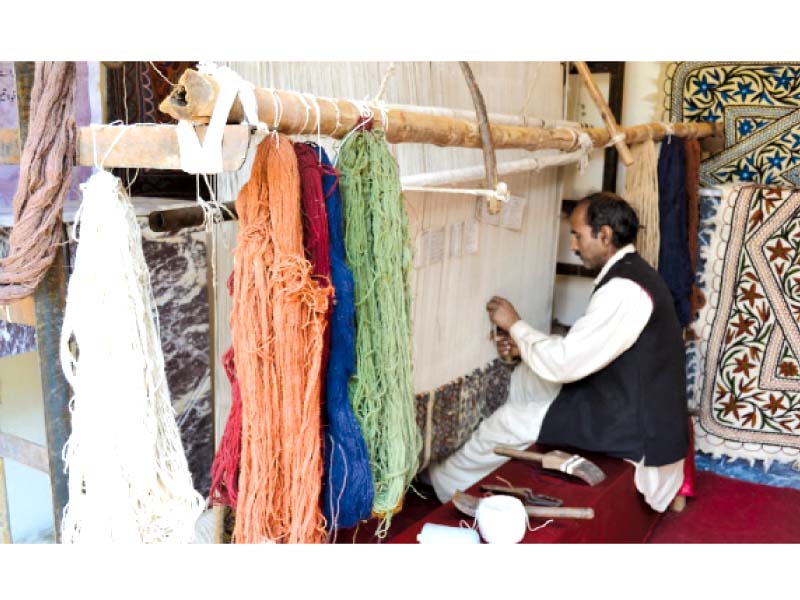 an artisan at work during a cultural festival in connection with the kashmir solidarity day at lok virsa on sunday photo news desk