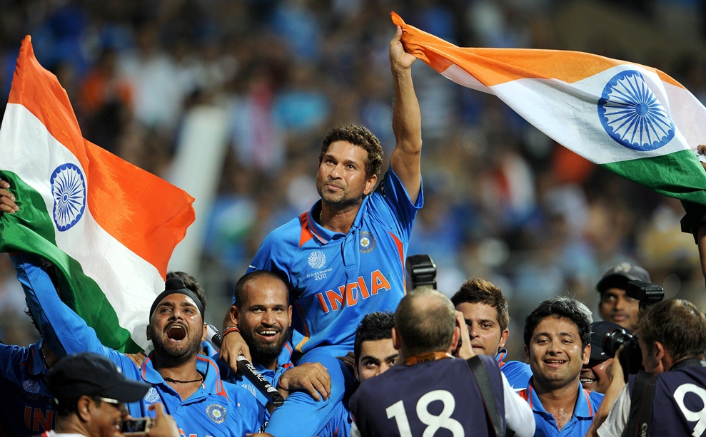 sachin tendulkar waves indian flag after his team defeated sri lanka in the icc cricket world cup 2011 final played at the wankhede stadium in mumbai on april 2 2011 photo afp