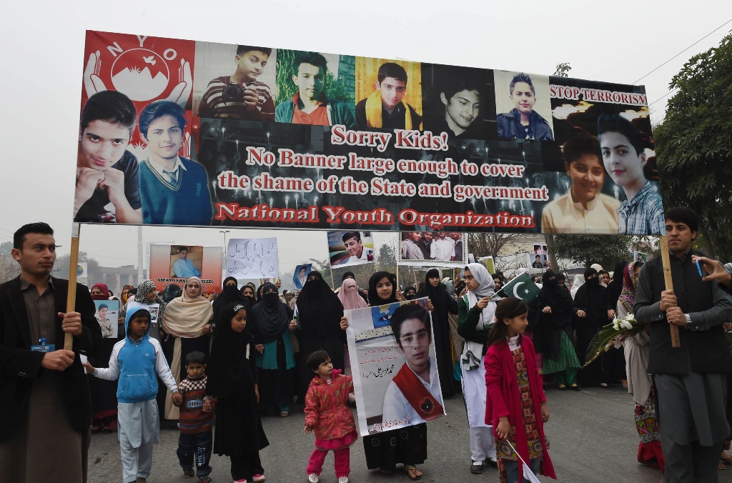 relatives of schoolchildren killed in taliban attack on army public school aps protest against delays in the investigation in peshawar on february 7 2015 photo afp