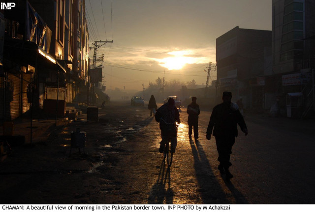 people walk through a street in chaman on saturday as many as 16 districts of balochistan faced loadshedding of up to 22 hours after militants blew up power pylons photo inp people walk through a street in chaman on saturday as many as 16 districts of balochistan faced loadshedding of up to 22 hours after militants blew up power pylons photo inp