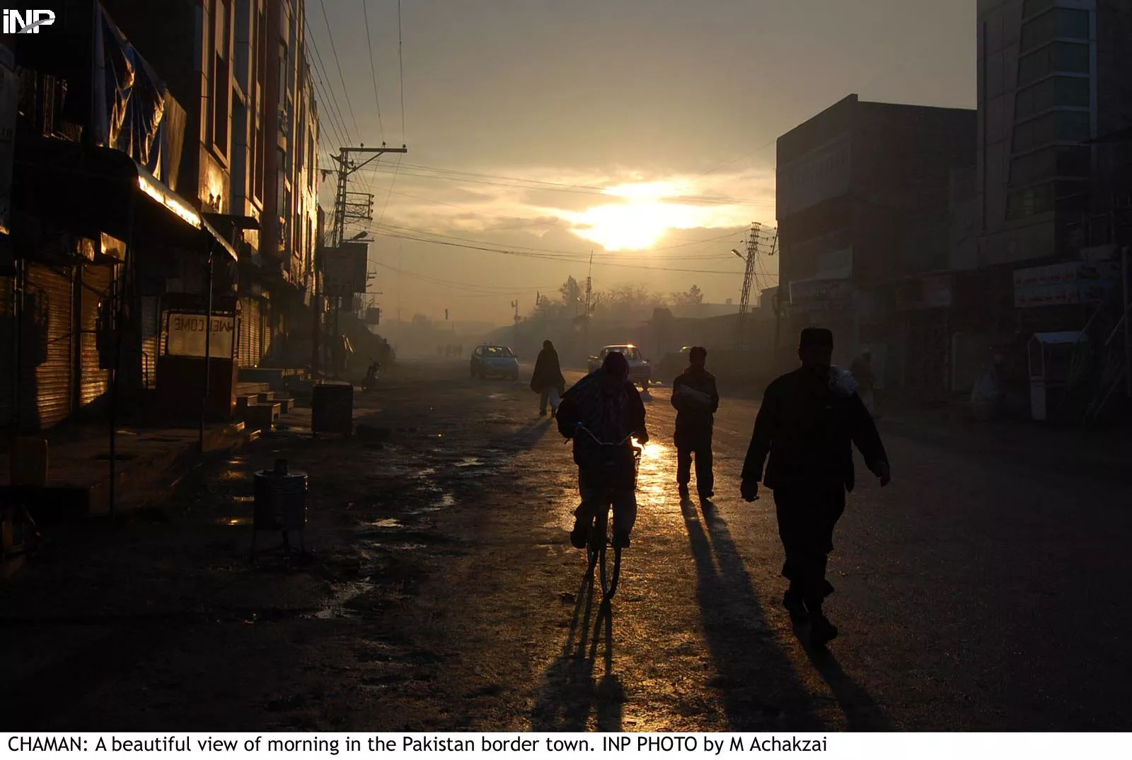 people walk through a street in chaman on saturday as many as 16 districts of balochistan faced loadshedding of up to 22 hours after militants blew up power pylons photo inp people walk through a street in chaman on saturday as many as 16 districts of balochistan faced loadshedding of up to 22 hours after militants blew up power pylons photo inp