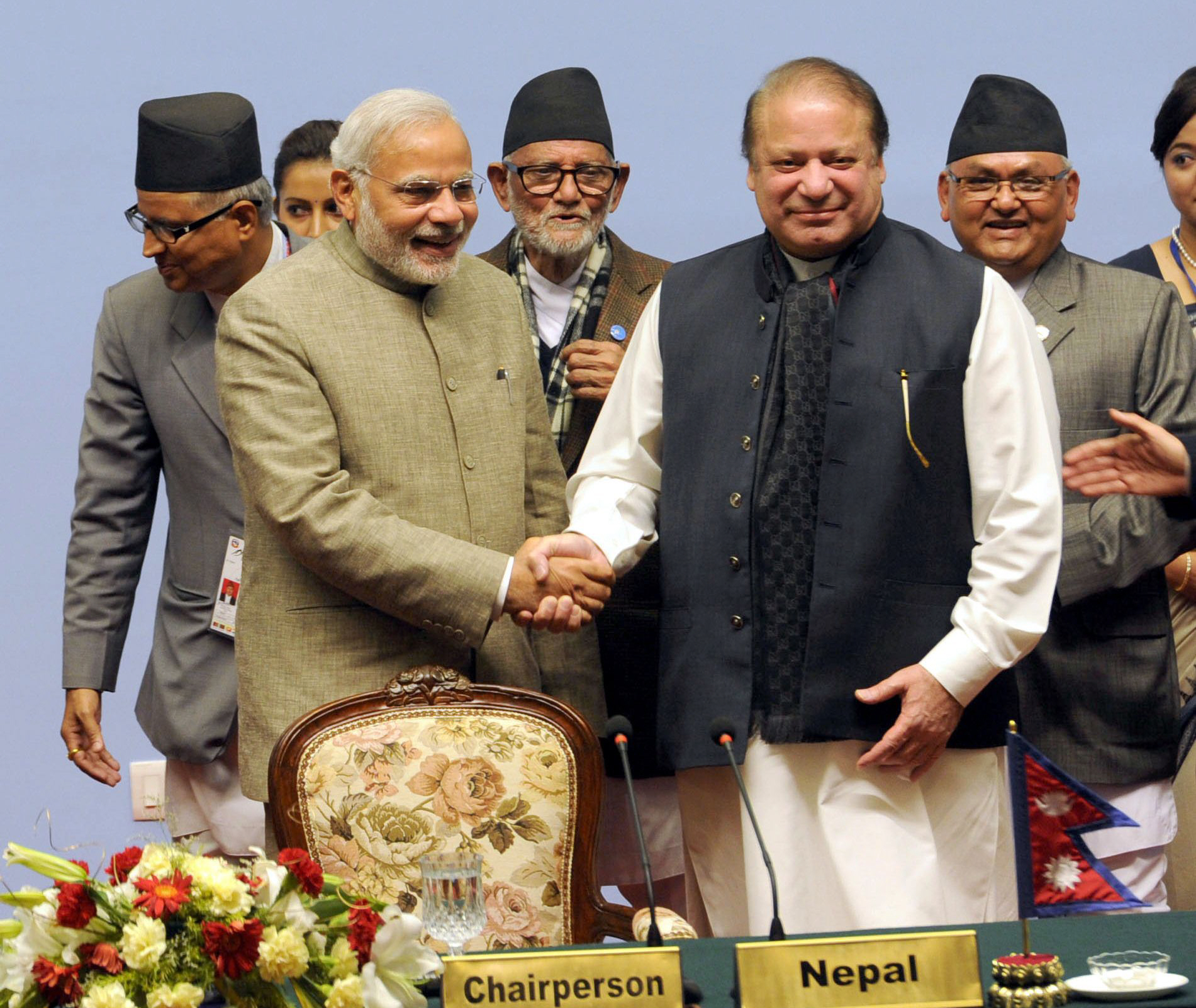in this handout photograph received from the indian press information bureau pib on november 27 2014 indian prime minister narendra modi l shakes hands with prime minister nawaz sharif at the 18th saarc summit in the nepalese capital kathmandu photo afp
