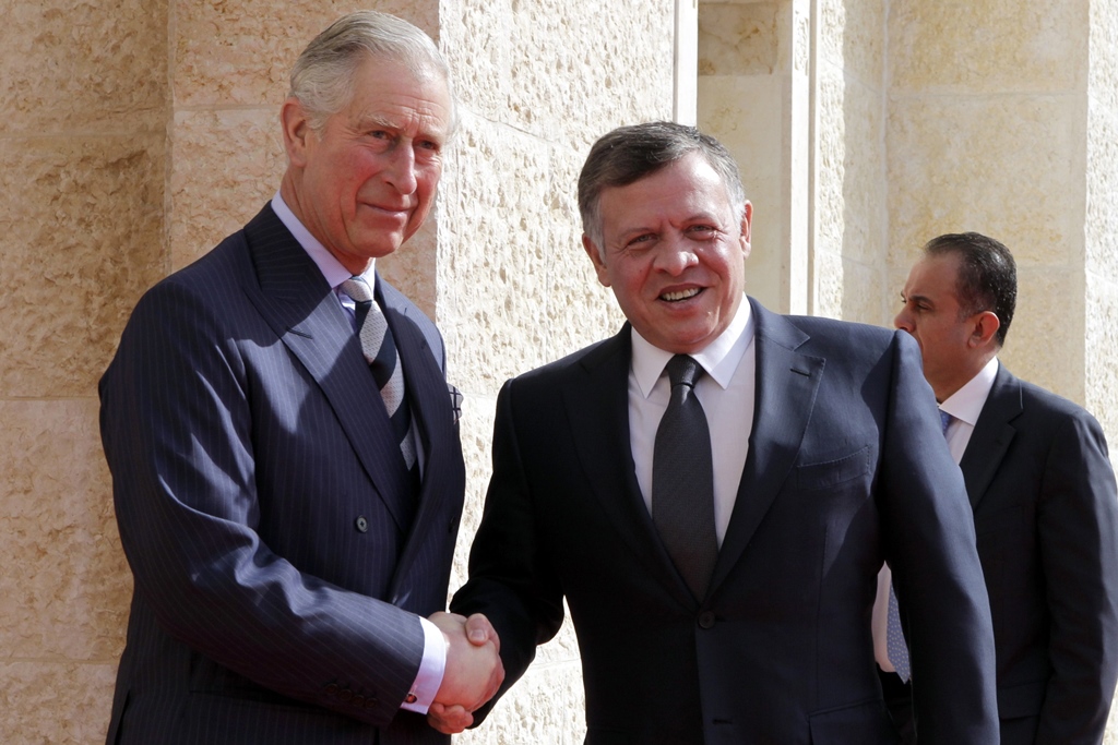 jordan 039 s king abdullah ii c r greets britain 039 s prince charles l prince of wales upon his arrival at the royal palace before a meeting on february 8 2015 photo afp