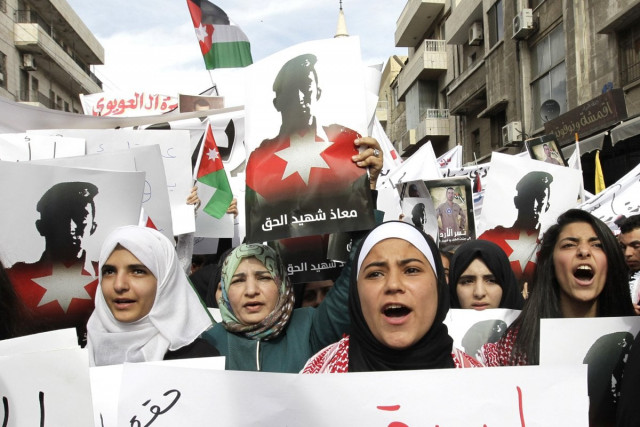 jordanians hold banners shouting slogans during a demonstration on february 6 2015 in the capital amman to express their solidarity with the pilot murdered by the islamic state is group photo afp jordanians hold banners shouting slogans during a demonstration on february 6 2015 in the capital amman to express their solidarity with the pilot murdered by the islamic state is group photo afp