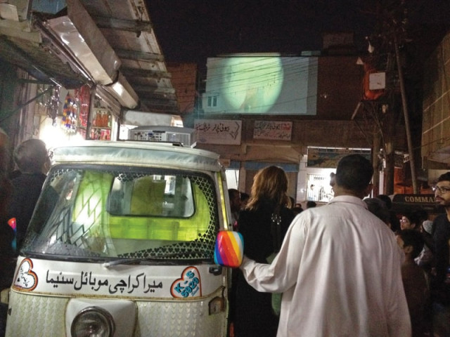 the mera karachi mobile cinema a rickshaw powered projector beams out a film artist naiza khan shot of the sea on to a wall in golimar s peetal galli on saturday evening photo mahim maher express left courtesy momin zafar right the mera karachi mobile cinema a rickshaw powered projector beams out a film artist naiza khan shot of the sea on to a wall in golimar s peetal galli on saturday evening photo mahim maher express left courtesy momin zafar right