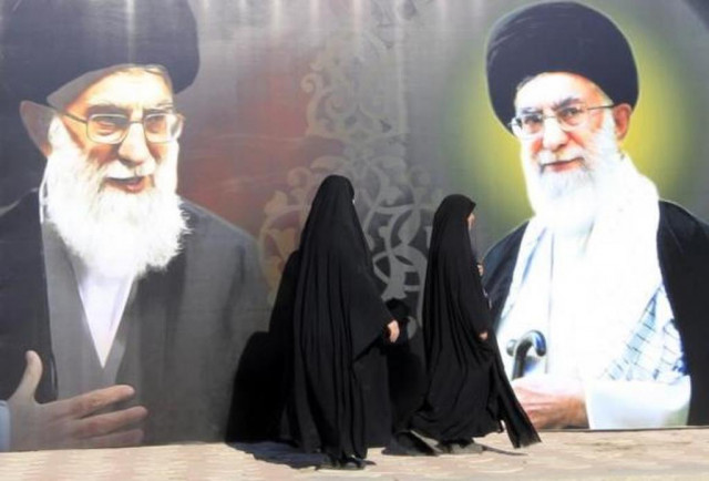 iraqi women walk past a poster depicting images of shi 039 ite iran 039 s supreme leader ayatollah ali khamenei at al firdous square in baghdad february 12 2014 photo reuters iraqi women walk past a poster depicting images of shi 039 ite iran 039 s supreme leader ayatollah ali khamenei at al firdous square in baghdad february 12 2014 photo reuters