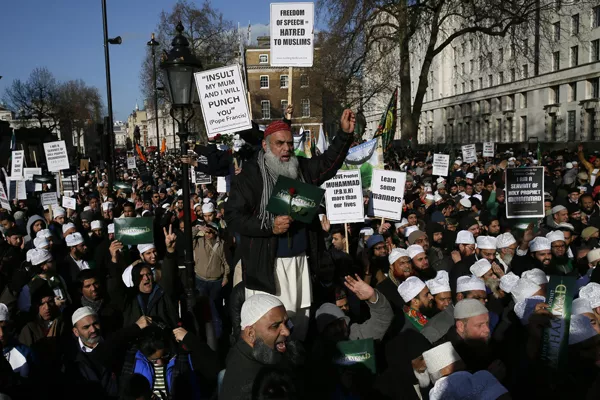 muslim demonstrators hold placards during a protest against the publication of cartoons depicting the prophet mohammad in french satirical weekly charlie hebdo near downing street in central london february 8 2015 at least 1 000 british muslims protested in central london on sunday against what they called quot insulting depictions quot of the prophet mohammad by french newspaper charlie hebdo the event comes weeks after 17 people were killed in three days of violence last month in france that began when two islamist gunmen burst into charlie hebdo 039 s paris offices opening fire in revenge for its publication of satirical images of mohammad sunday 039 s protest organisers condemned the paris attacks but said the magazine should not publish cartoons of the prophet photo reuters muslim demonstrators hold placards during a protest against the publication of cartoons depicting the prophet mohammad in french satirical weekly charlie hebdo near downing street in central london february 8 2015 at least 1 000 british muslims protested in central london on sunday against what they called quot insulting depictions quot of the prophet mohammad by french newspaper charlie hebdo the event comes weeks after 17 people were killed in three days of violence last month in france that began when two islamist gunmen burst into charlie hebdo 039 s paris offices opening fire in revenge for its publication of satirical images of mohammad sunday 039 s protest organisers condemned the paris attacks but said the magazine should not publish cartoons of the prophet photo reuters