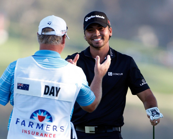 jason day r of australia celebrates wiht his caddie after his victory on the second playoff hole during the final round of the farmers insurance open at torrey pines south on february 8 2015 in la jolla california photo afp jason day r of australia celebrates wiht his caddie after his victory on the second playoff hole during the final round of the farmers insurance open at torrey pines south on february 8 2015 in la jolla california photo afp