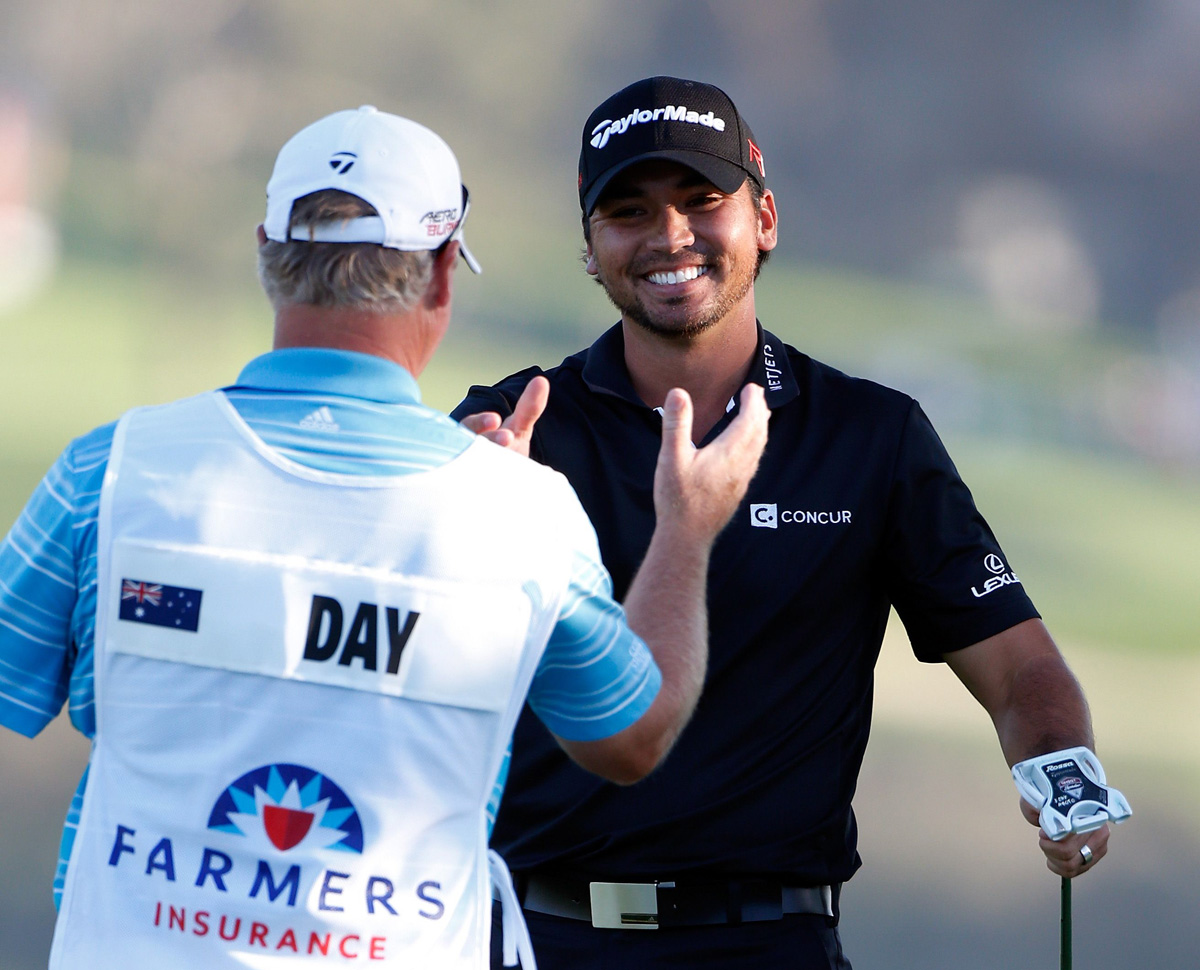 jason day r of australia celebrates wiht his caddie after his victory on the second playoff hole during the final round of the farmers insurance open at torrey pines south on february 8 2015 in la jolla california photo afp