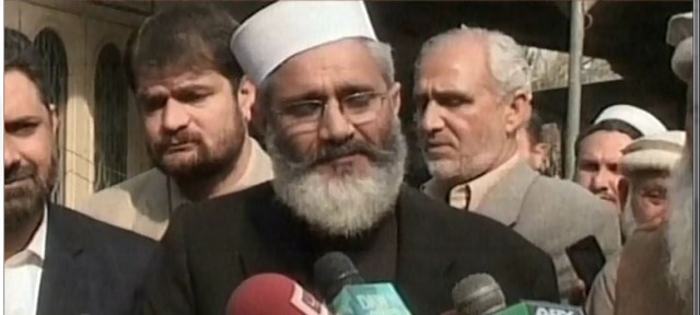 an express news screen grab of sirajul haq addressing the media